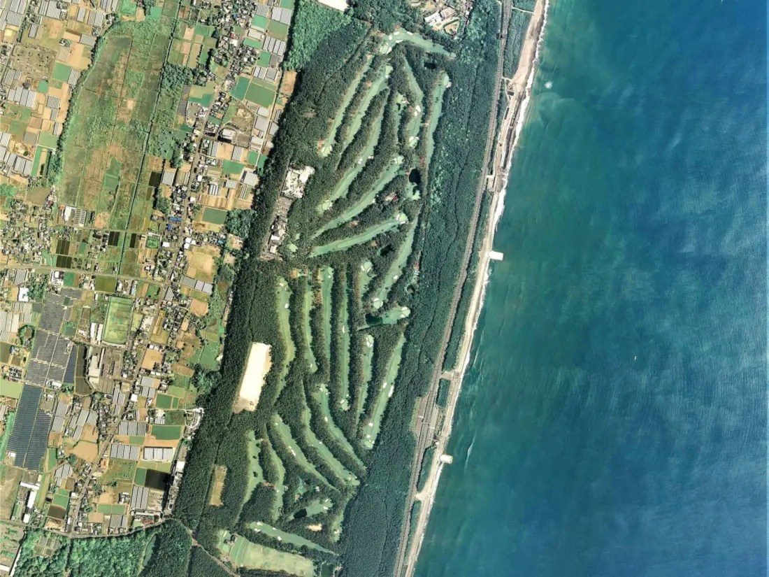 Aerial survey photograph of Phoenix Country Club, laid out in a strip of pine woodland along the Miyazaki coast